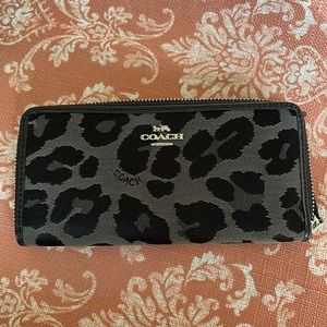 Black and grey leopard print Coach wallet. New without tags. Zip around style.